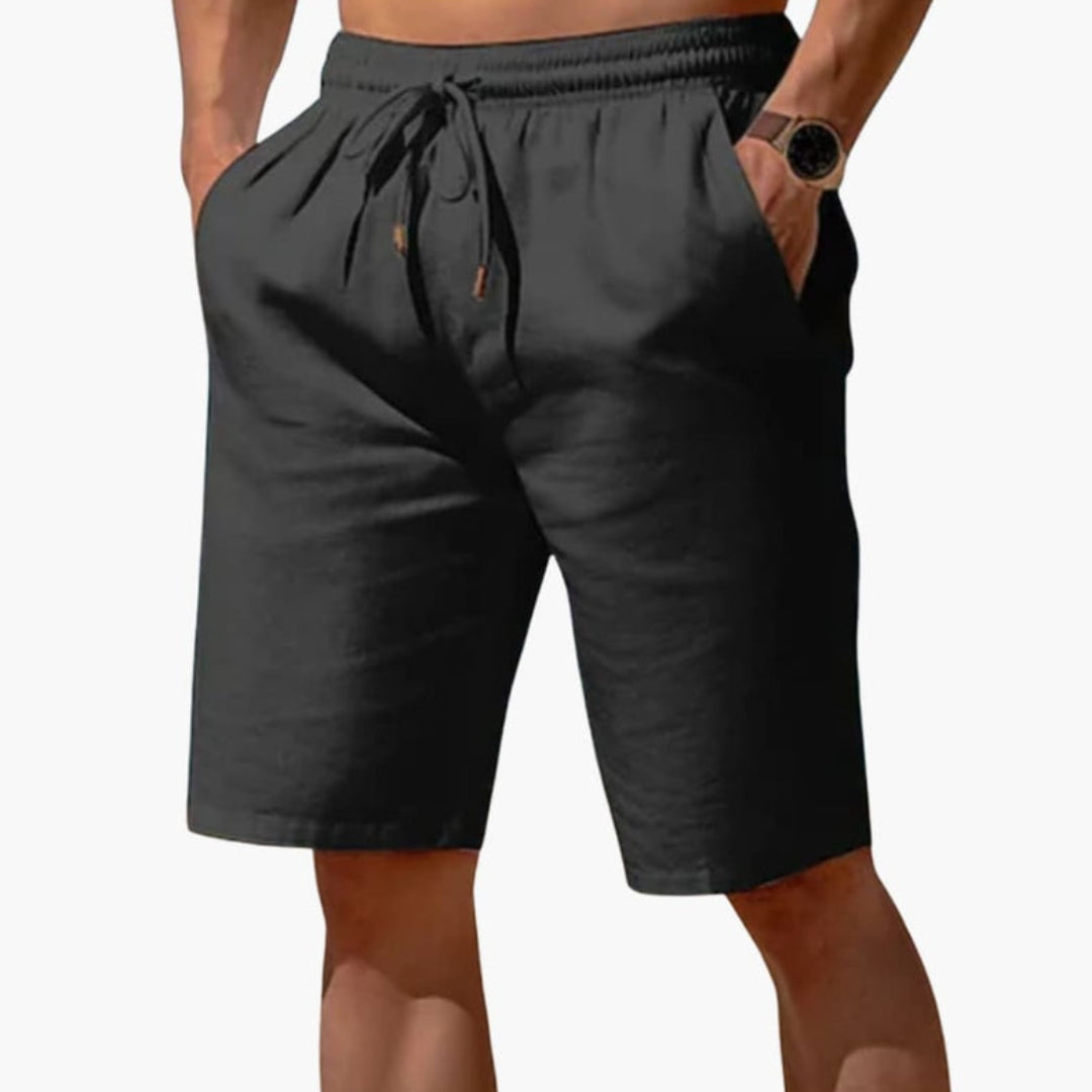 Short homme a taille à poches latérales et  surface unie