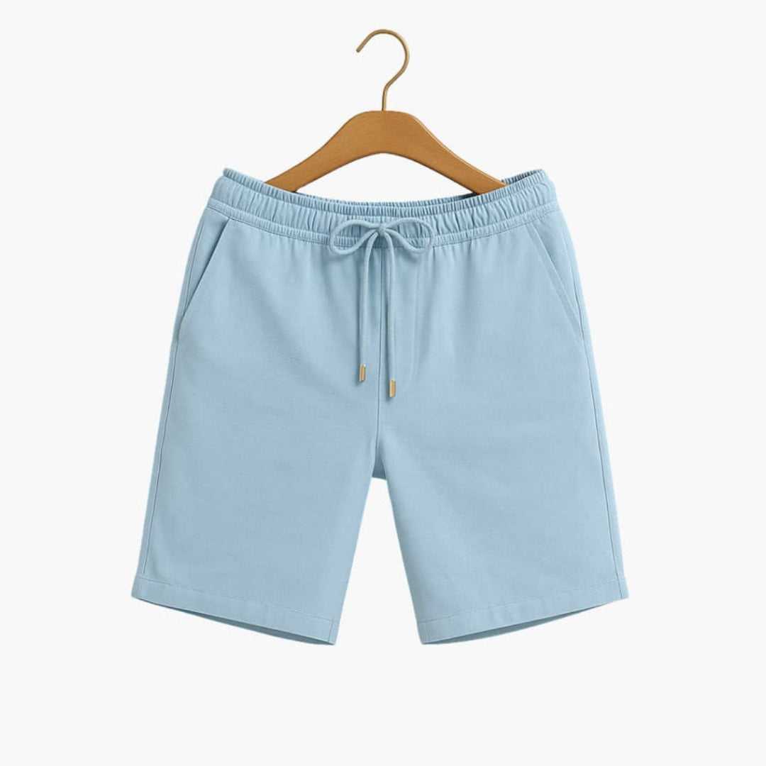 Short homme a taille à poches latérales et  surface unie