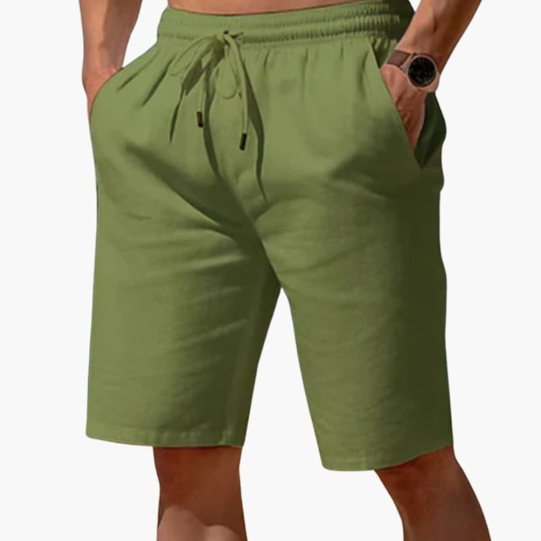 Short homme a taille à poches latérales et  surface unie