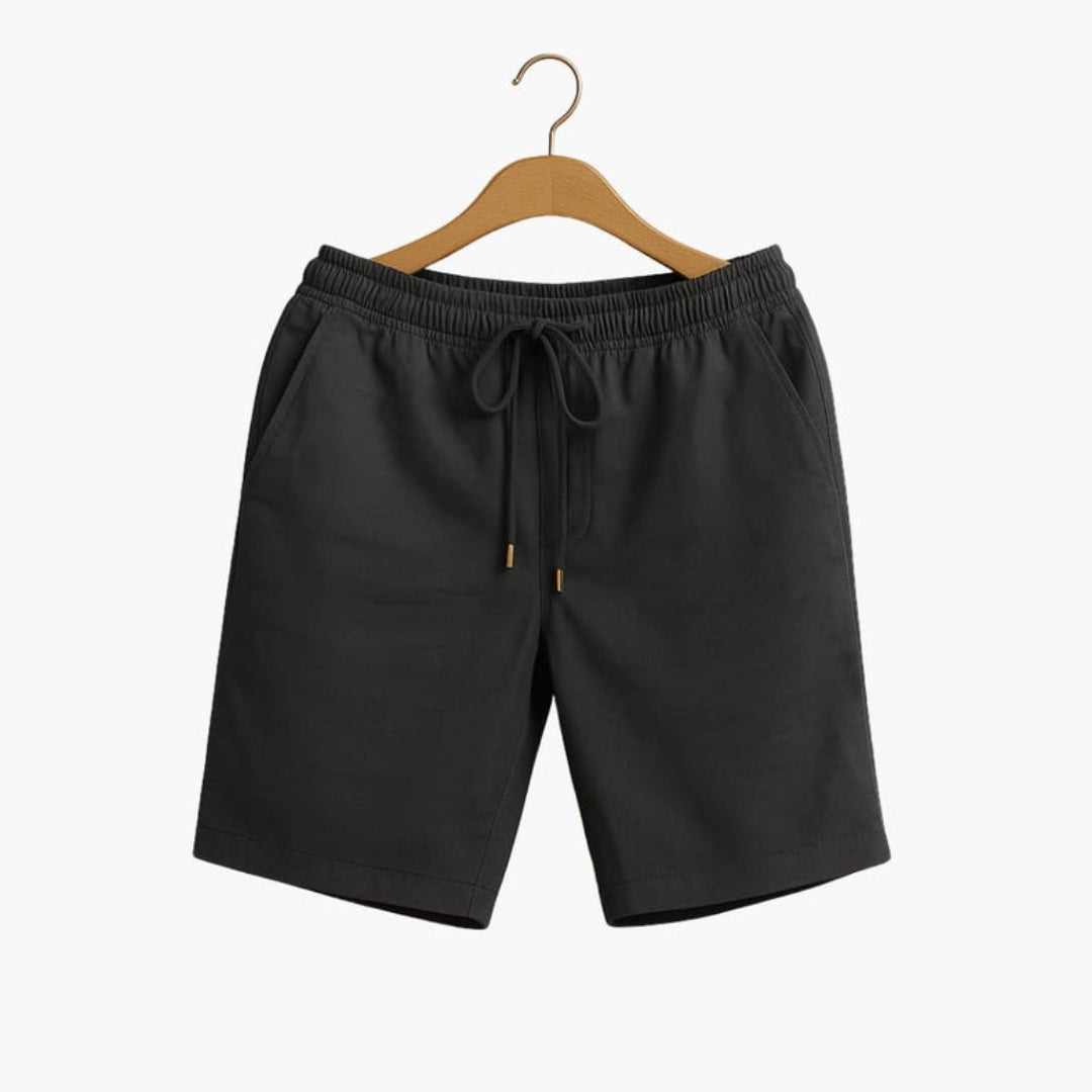 Short homme a taille à poches latérales et  surface unie